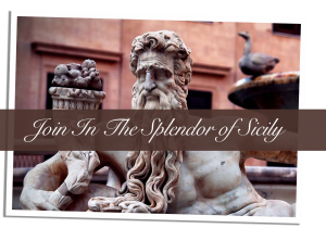 A statue of a man with long beard and curly hair.