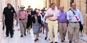 A group of people walking down the street