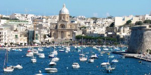 A large body of water with many small boats in it.