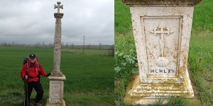 A cross and grave marker in the middle of nowhere.