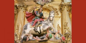 A statue of st. George and the dragon is on display in a church