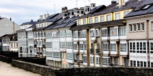 A row of buildings with windows on the side.
