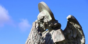 A statue of a woman with a helmet on her head.