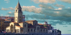 A church with a clock tower in the background.