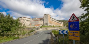 A road with a building on the side of it