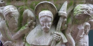 A statue of an angel holding a staff.