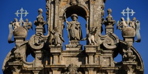 A statue of a person in an ornate building.