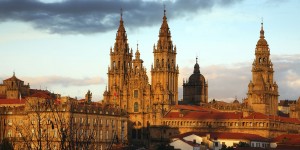 A cathedral with two towers and a sky background