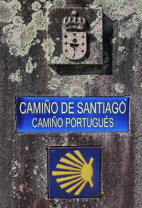 A close up of some signs on the side of a building