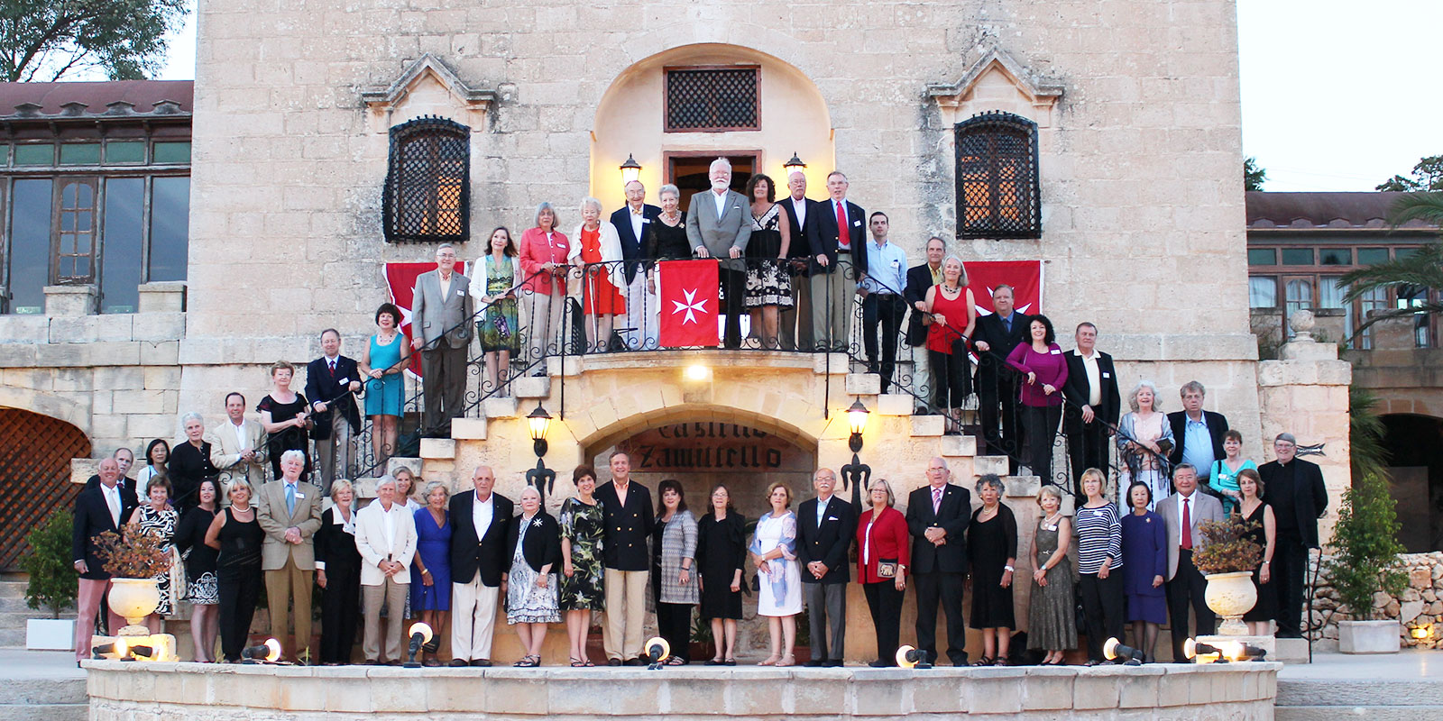 A group of people standing on top of steps.