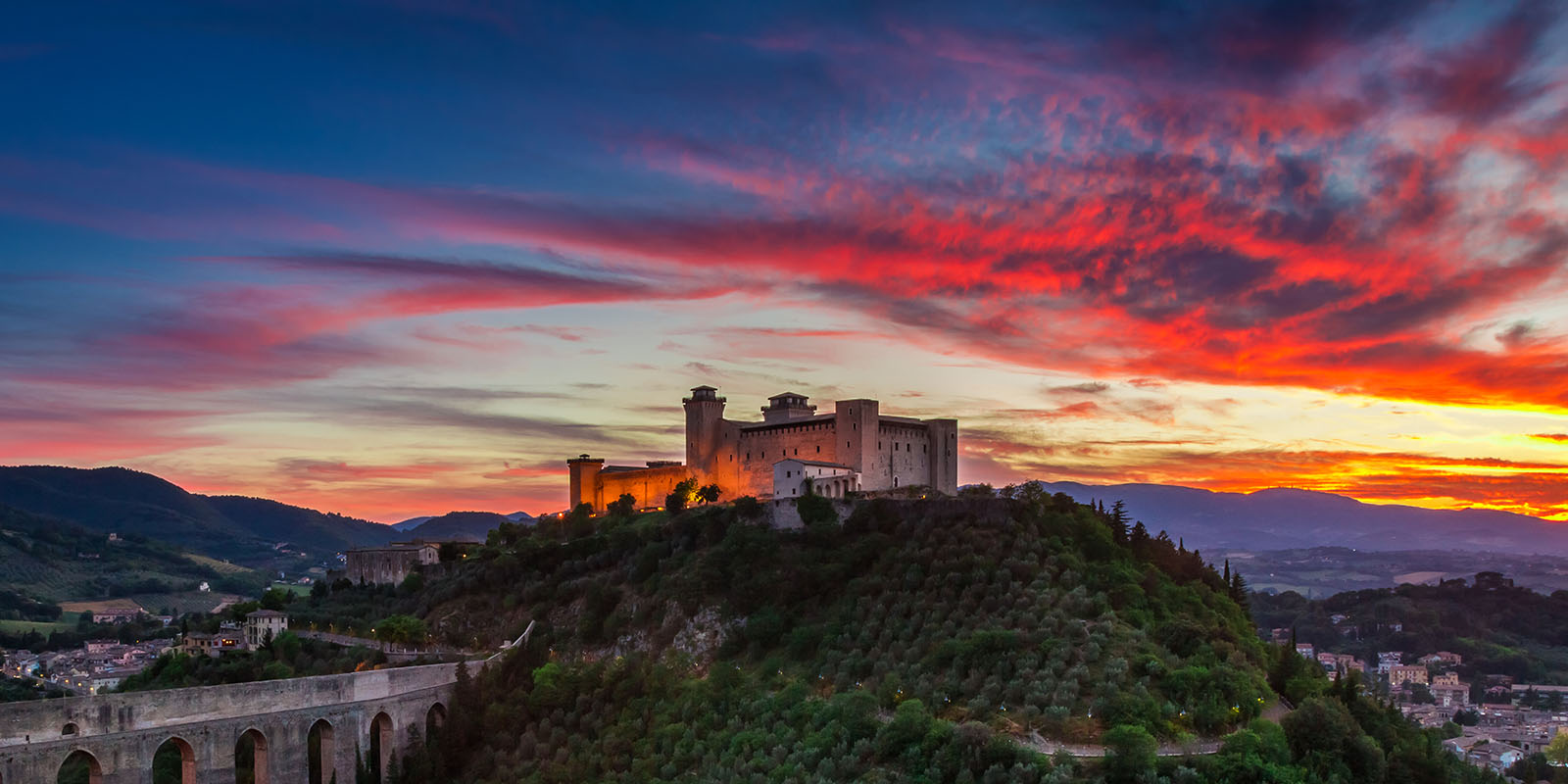 A castle on top of a hill with the sky in the background