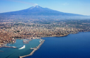 Sicily with volcano in the background.