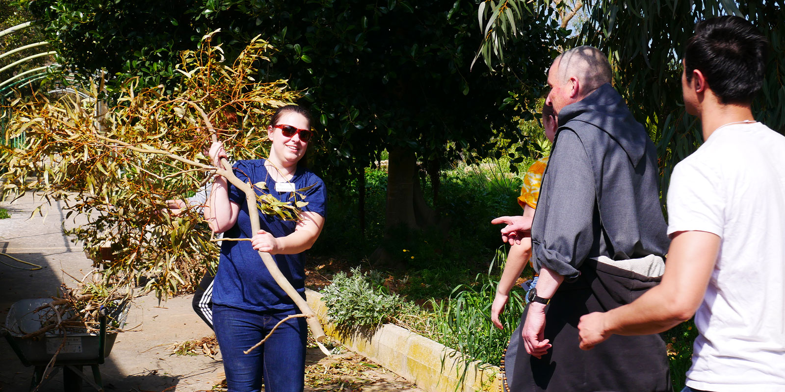 College student on MedSeas mission trip cleaning up after hurricane.