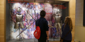 Students in front of a Knights of St. John display on their MedSeas Malta Trip.